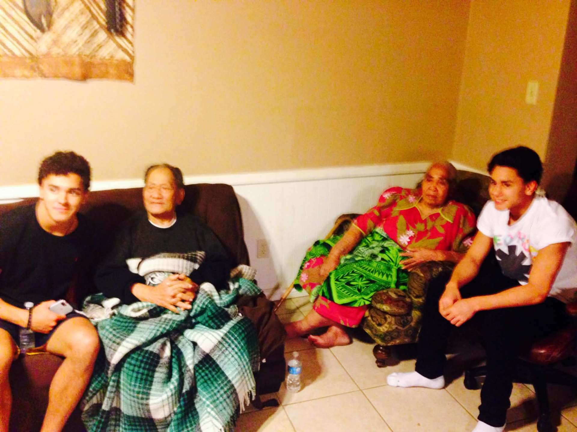 McCann Jr. and Josiah with their grandparents on the couch